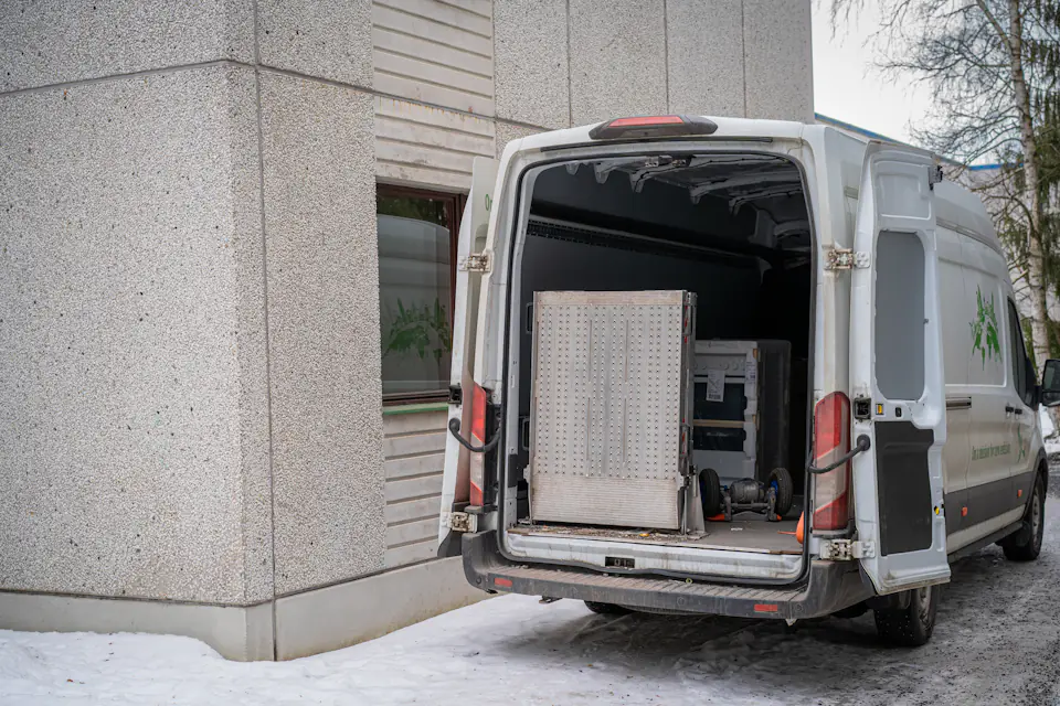 Van ready to load for a Newcastle man and van job White van parked beside a building with its rear doors open