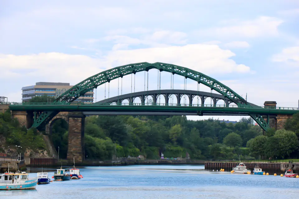 Green steel arch of the Wearmouth Bridge over the River Wear in Sunderland