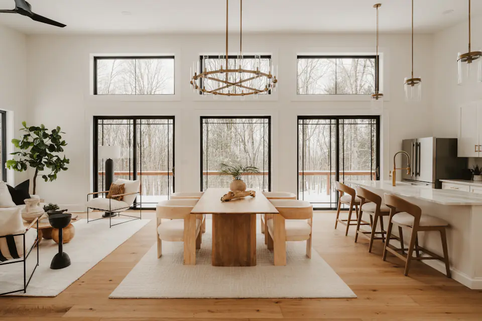 Bright open plan dining and living area with large windows